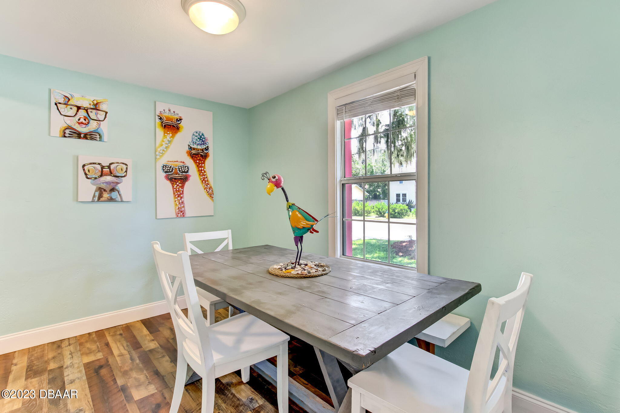 827 South Beach Street Daytona Beach, FL 32114 - Photo 13 of 40 a view of a dining room with furniture wooden floor and a window
