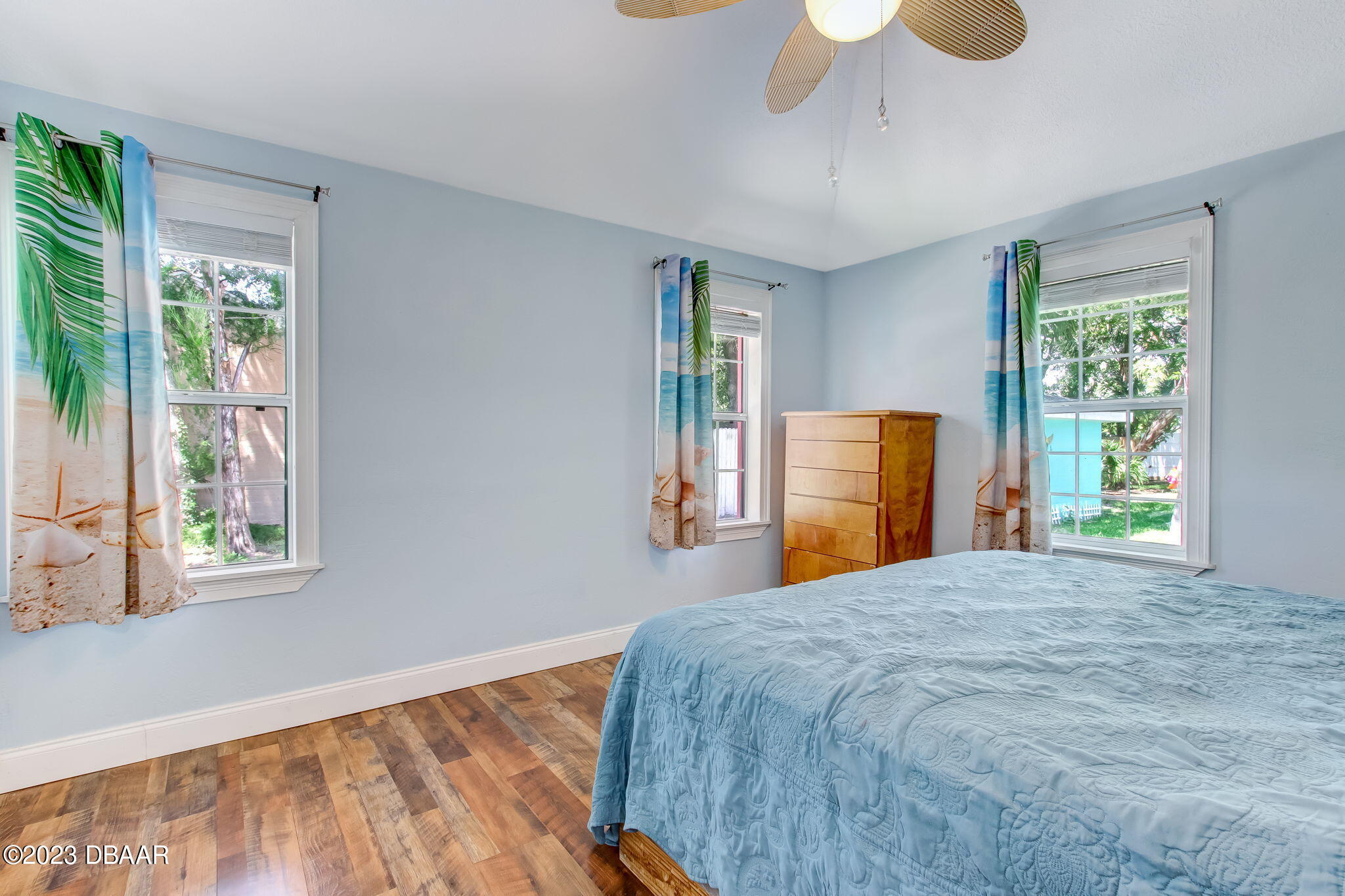 827 South Beach Street Daytona Beach, FL 32114 - Photo 19 of 40 a bedroom with a bed and a large window