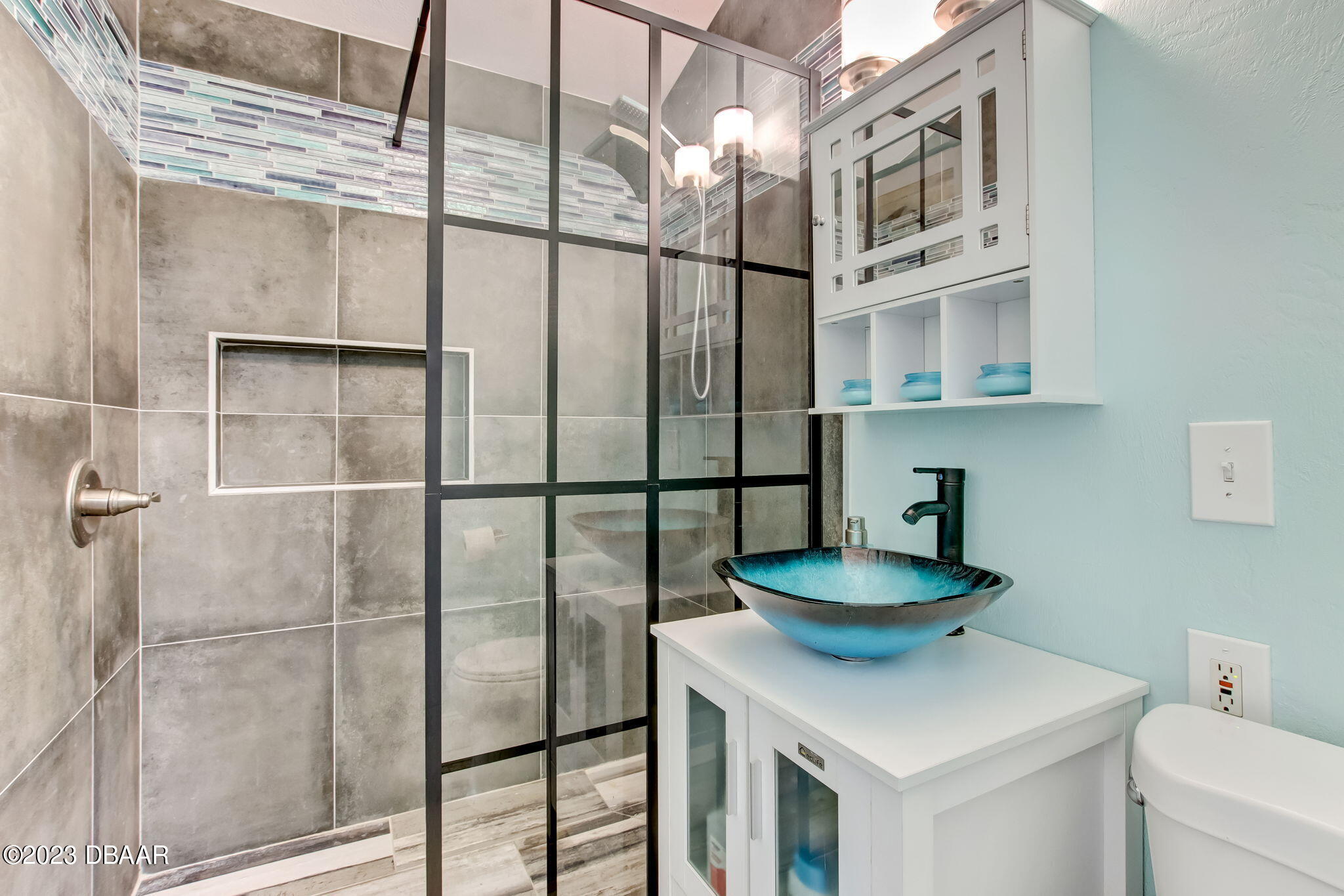 827 South Beach Street Daytona Beach, FL 32114 - Photo 22 of 40 a bathroom with a sink and a toilet