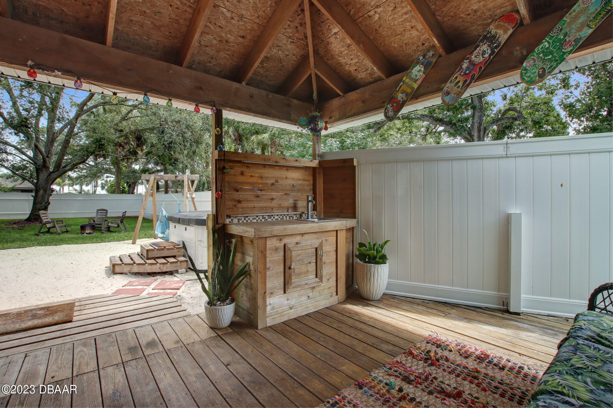 827 South Beach Street Daytona Beach, FL 32114 - Photo 25 of 40 a view of a backyard with sitting area