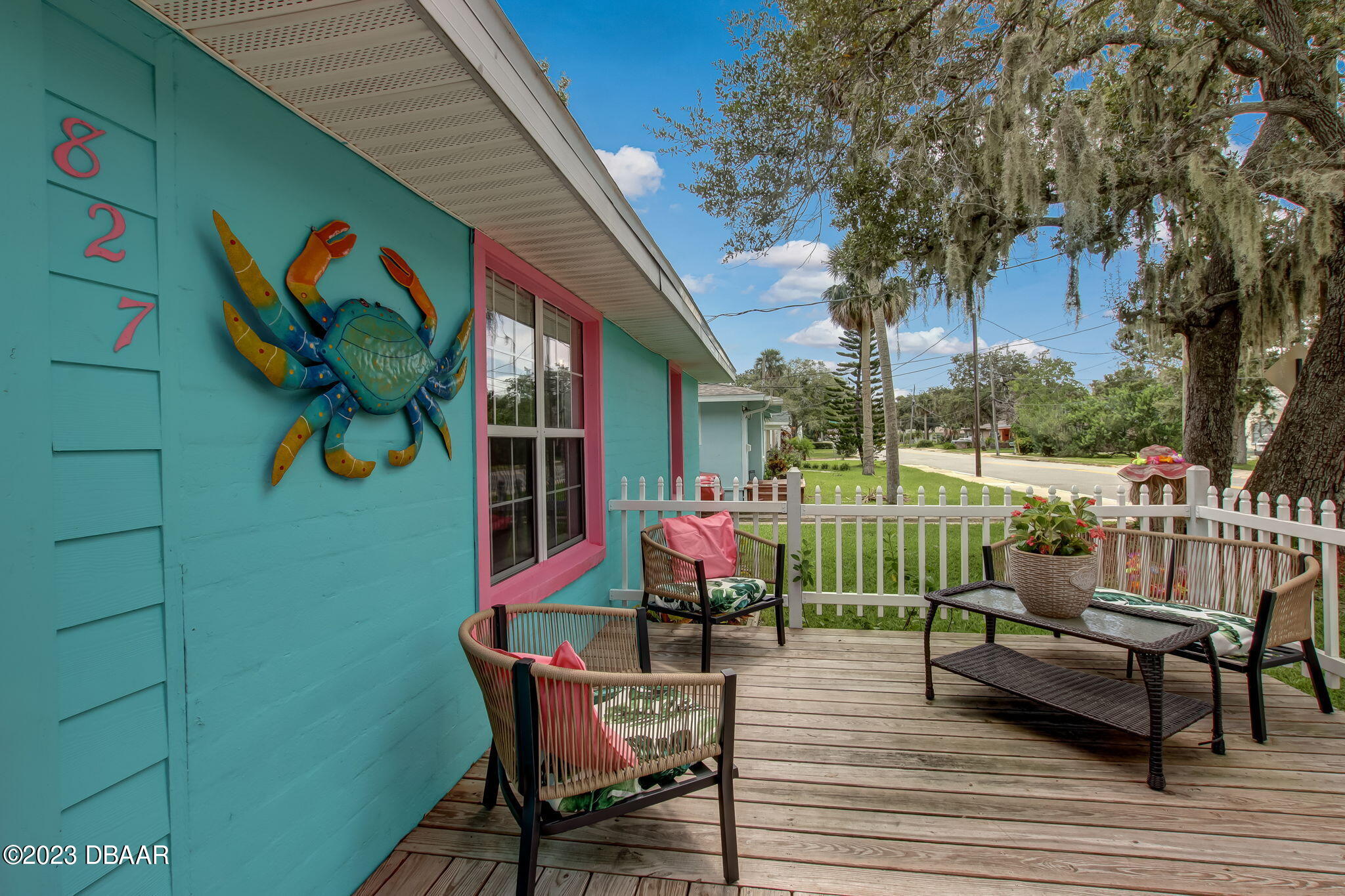 827 South Beach Street Daytona Beach, FL 32114 - Photo 3 of 40 a view of a two chairs in the deck