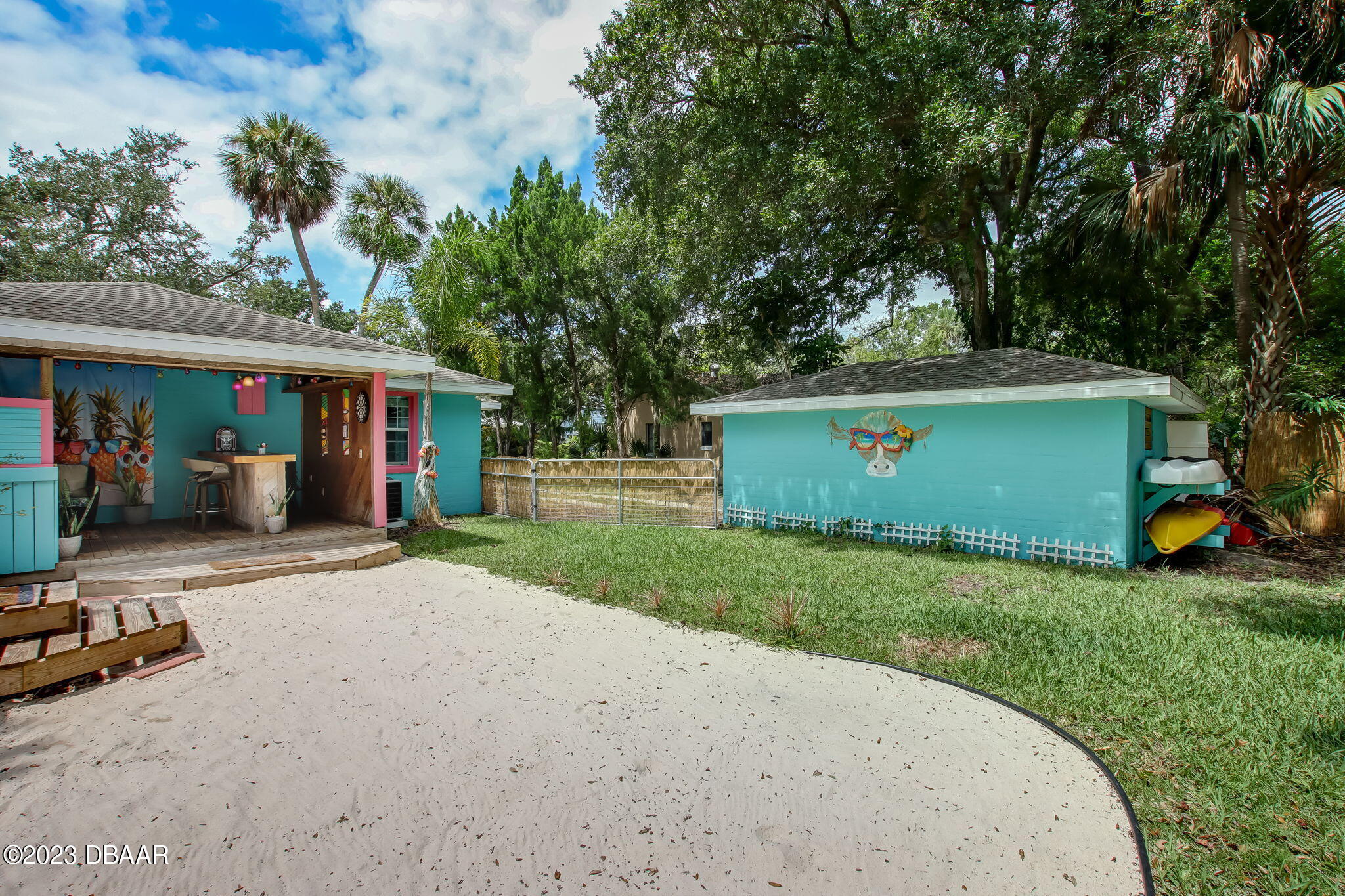 827 South Beach Street Daytona Beach, FL 32114 - Photo 31 of 40 a view of a house with backyard and a tree