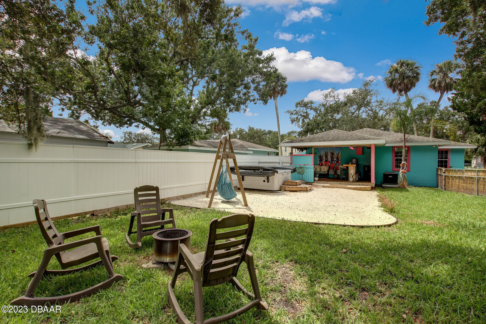 827 South Beach Street Daytona Beach, FL 32114 - Photo 33 of 40 a view of a house with backyard sitting area and garden