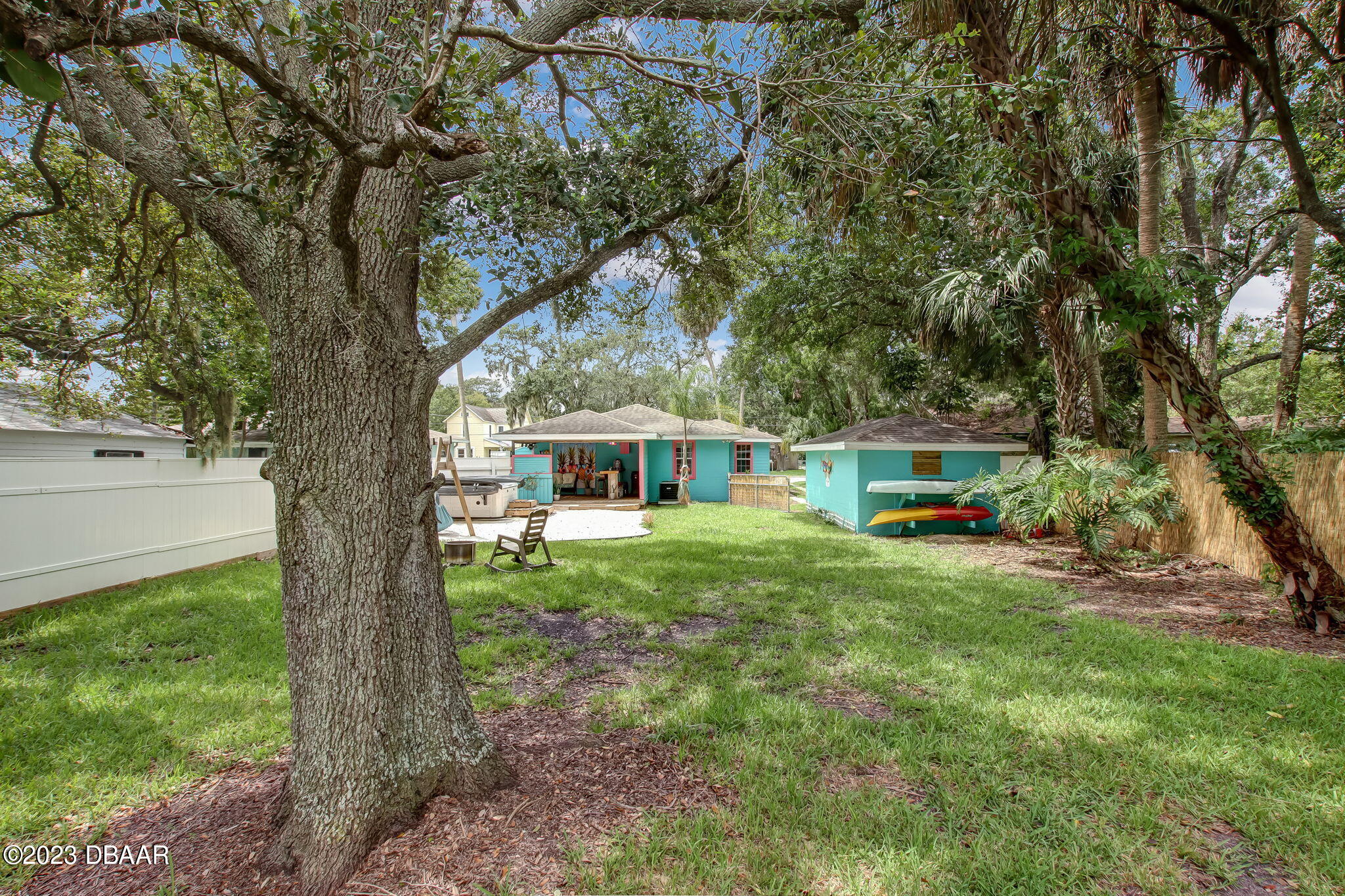 827 South Beach Street Daytona Beach, FL 32114 - Photo 35 of 40 a view of a house with backyard and sitting area