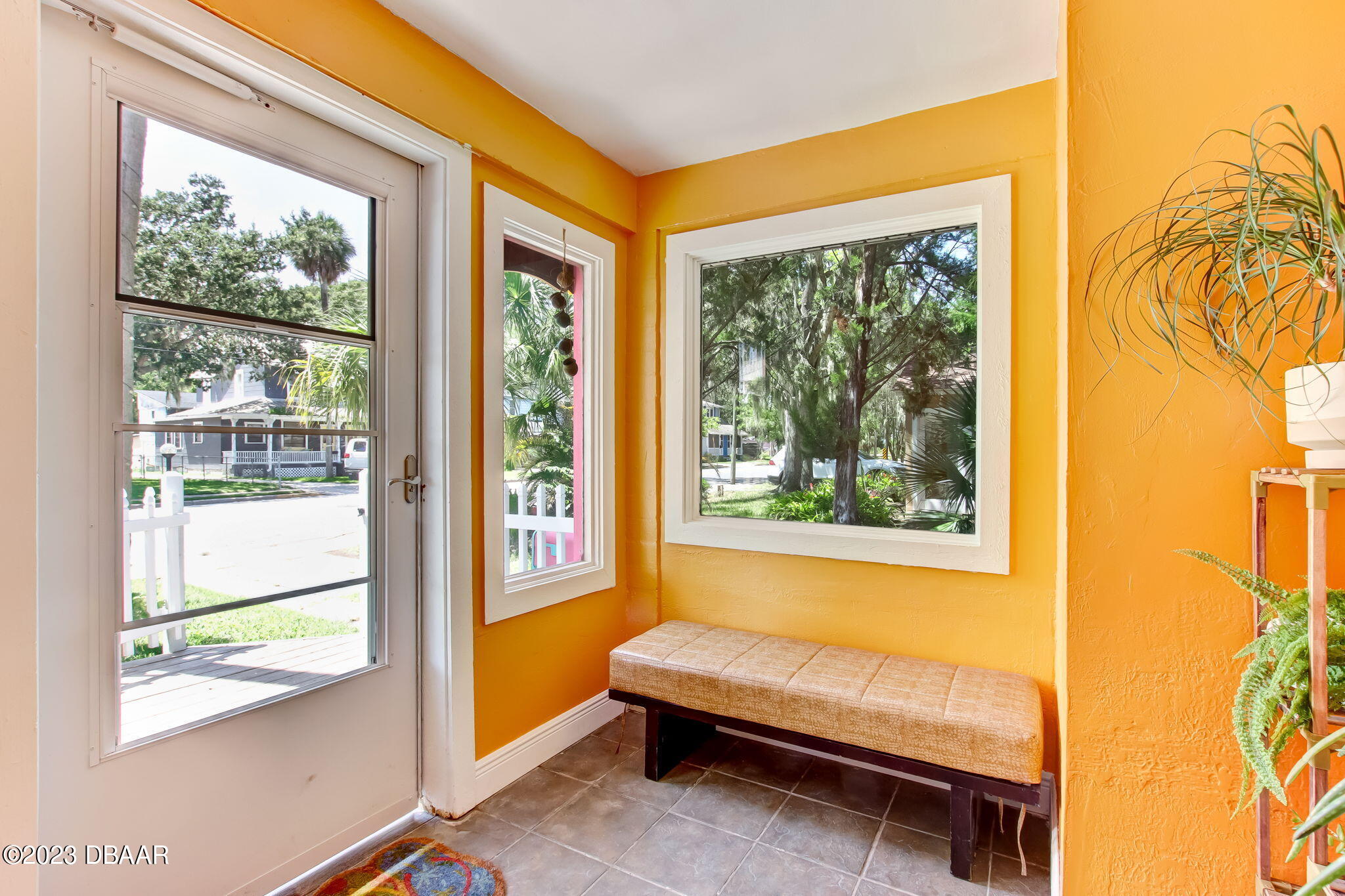 827 South Beach Street Daytona Beach, FL 32114 - Photo 5 of 40 a bedroom with a bed and a window