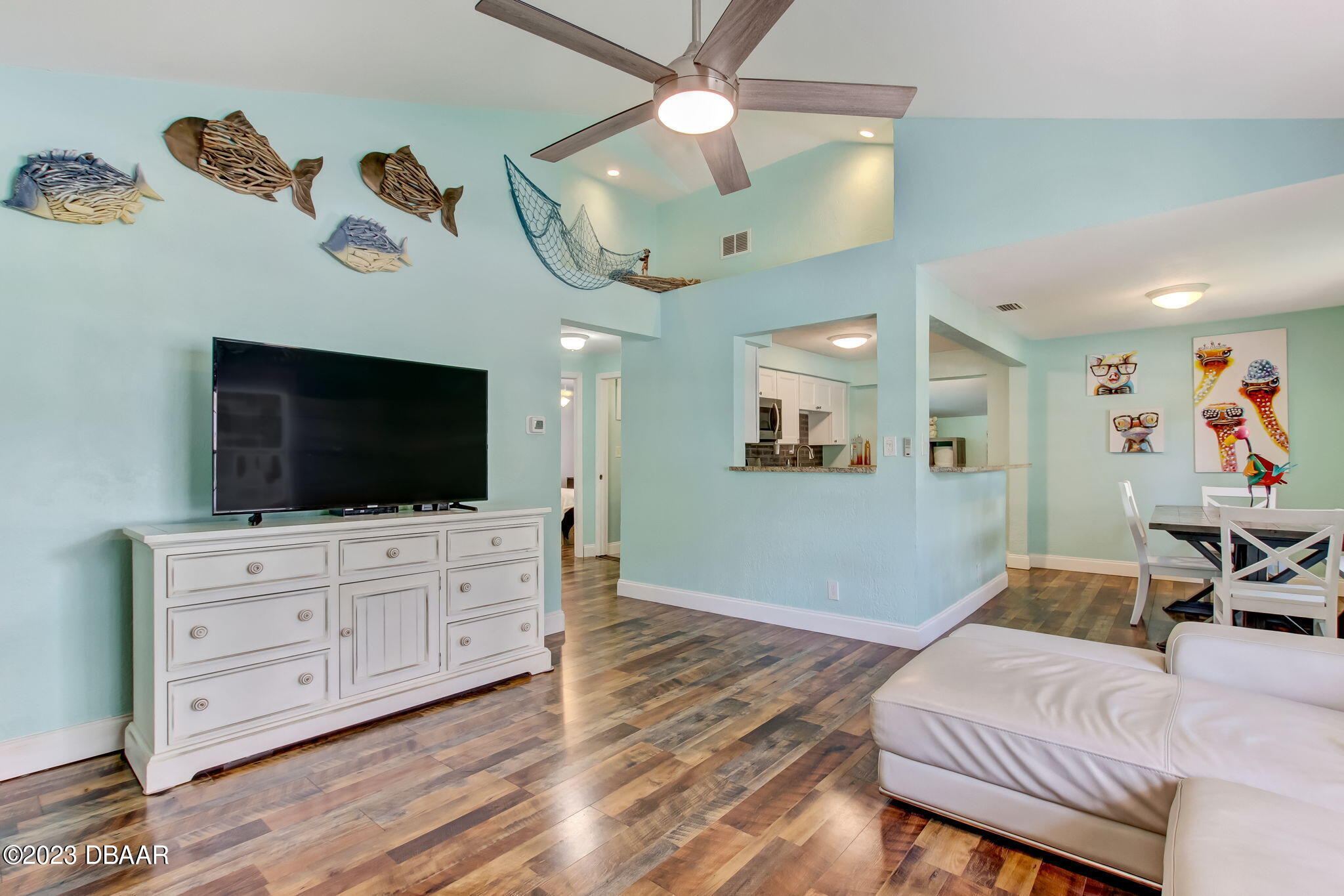 827 South Beach Street Daytona Beach, FL 32114 - Photo 7 of 40 a living room with furniture and a flat screen tv