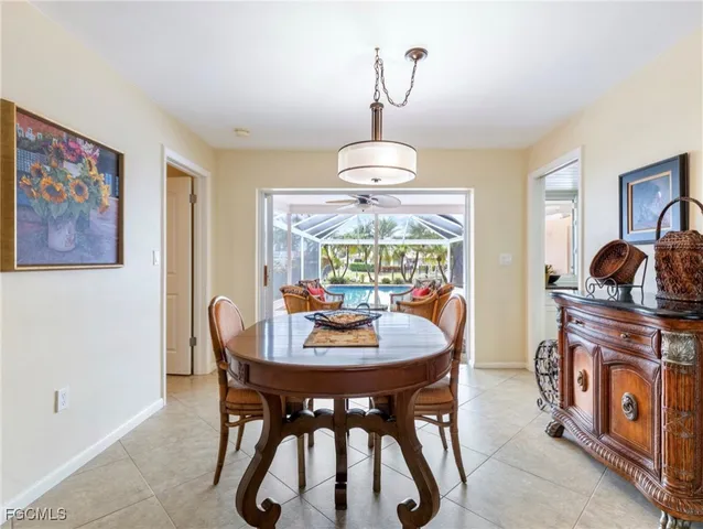 a view of a dining room with furniture wooden floor and chandelier