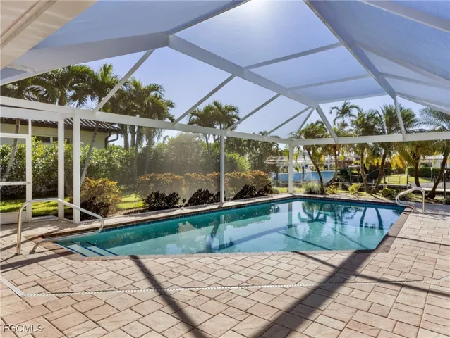 a view of a swimming pool with a patio