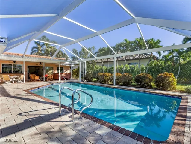 a view of a swimming pool with a patio