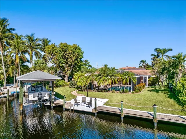 a view of swimming pool with outdoor seating and yard