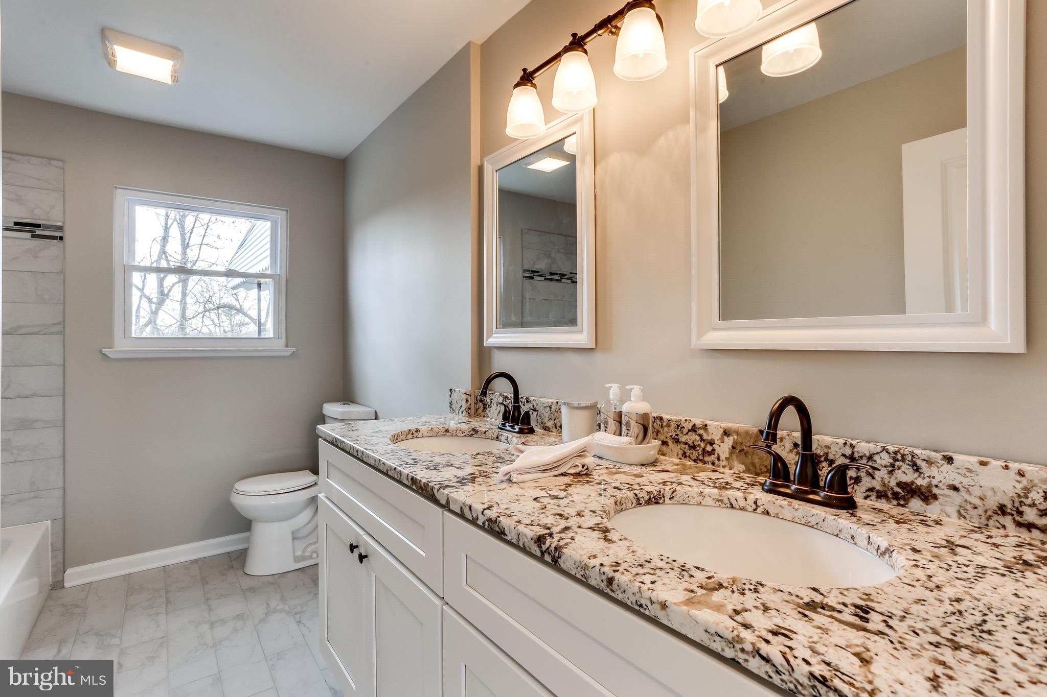 1515 Adamsview Road Baltimore, MD 21228 - Photo 11 of 26 Vanity perfectly ties in granite from the kitchen.