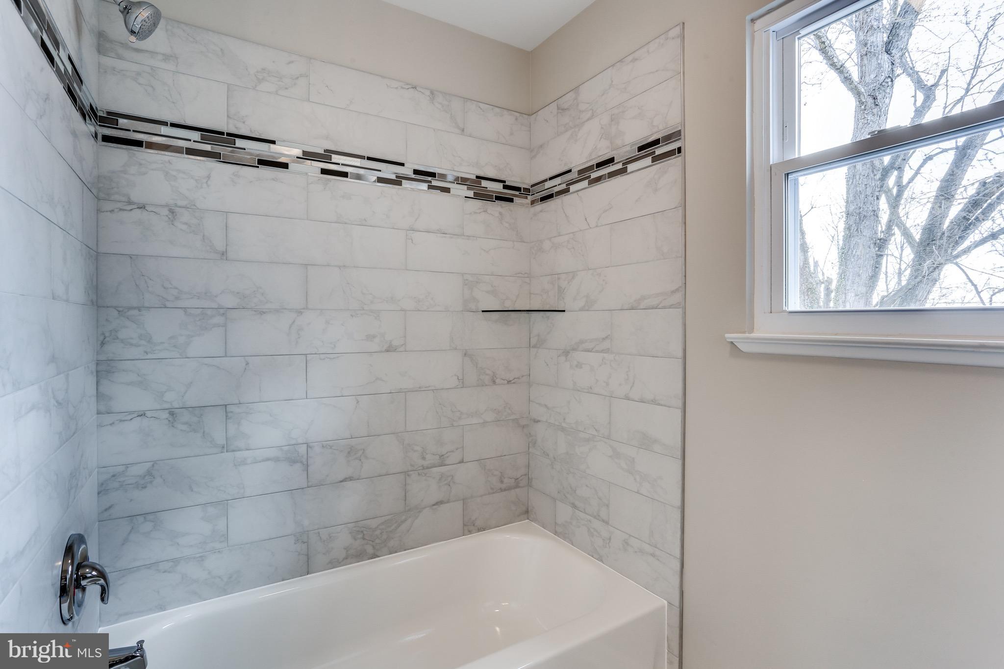 1515 Adamsview Road Baltimore, MD 21228 - Photo 12 of 26 Accent mosaic tile in bath