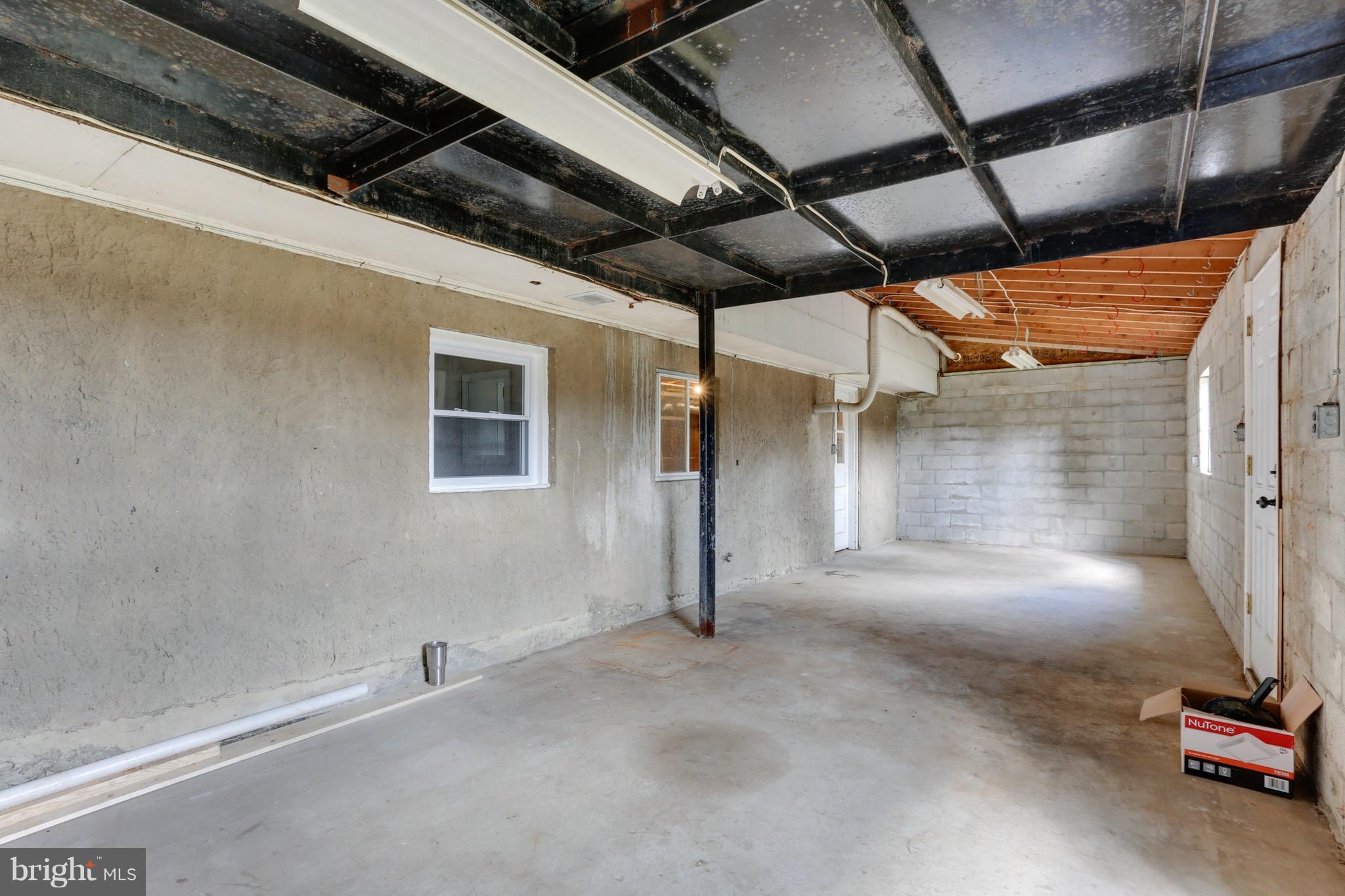 1515 Adamsview Road Baltimore, MD 21228 - Photo 24 of 26 Massive storage/workshop room off basement