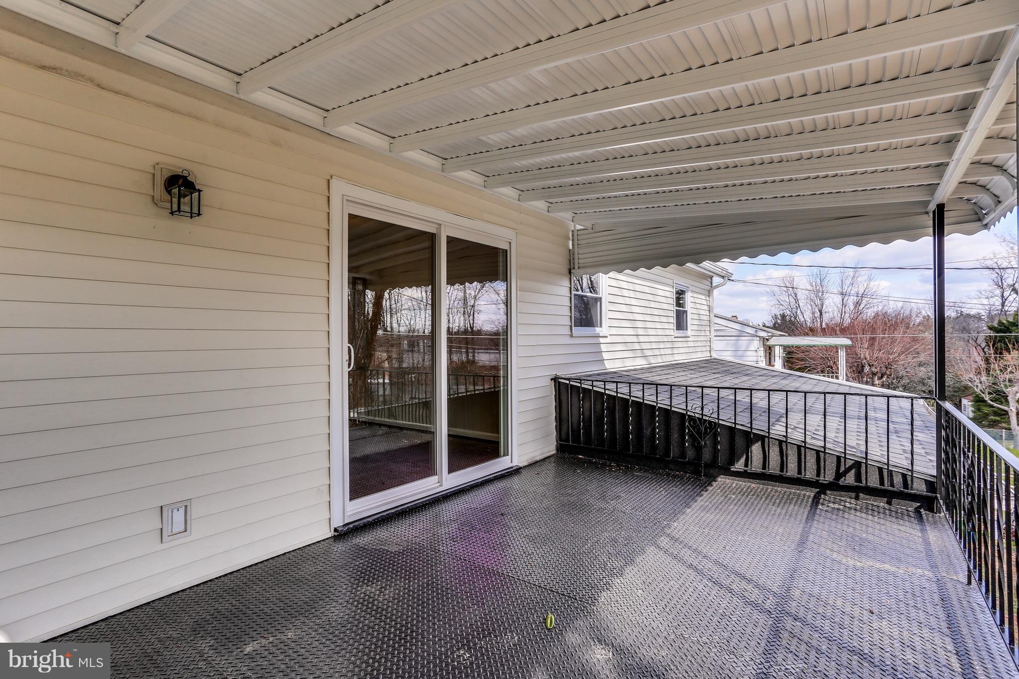 1515 Adamsview Road Baltimore, MD 21228 - Photo 25 of 26 Covered porch has steps down to backyard.