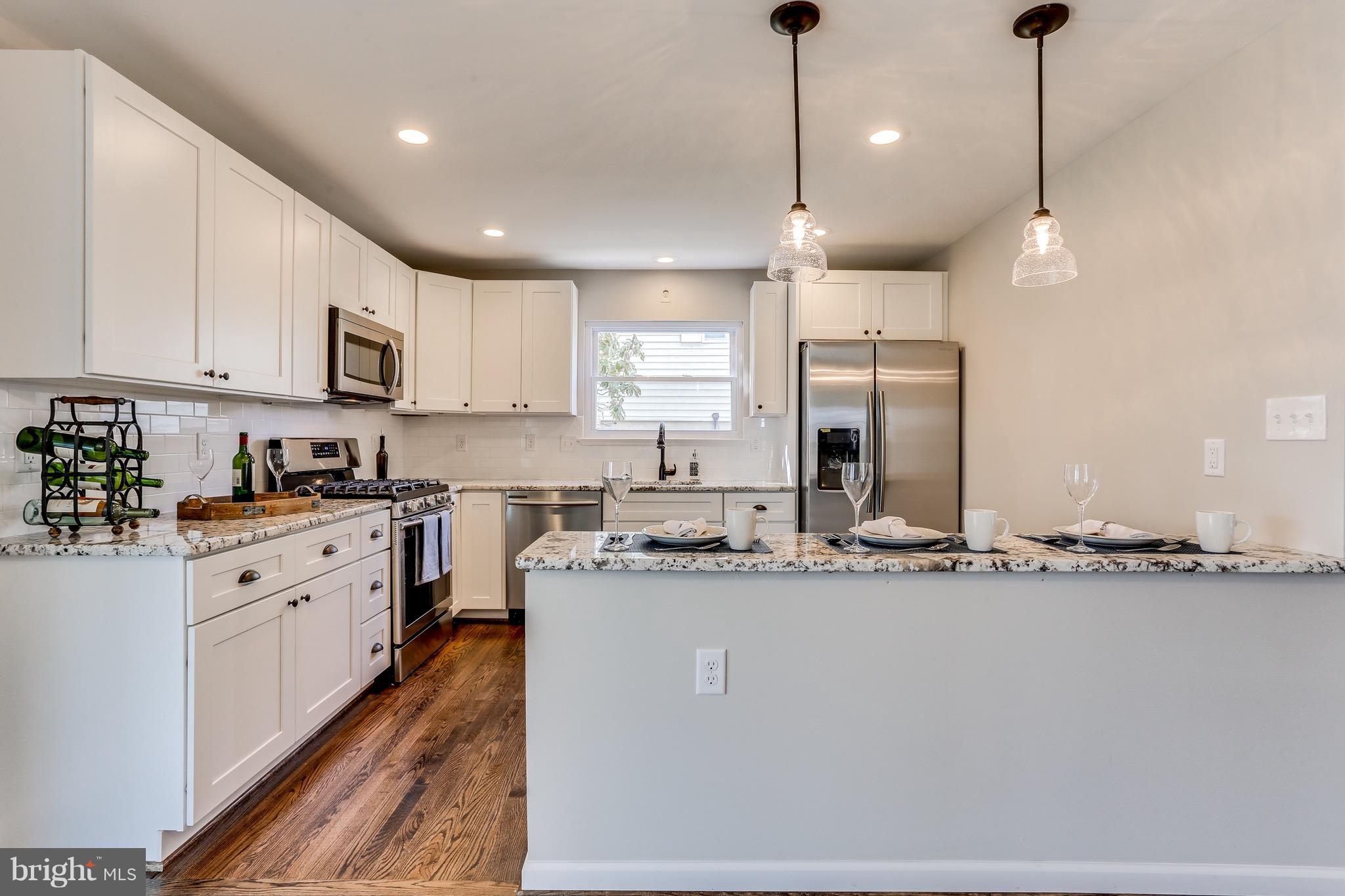 1515 Adamsview Road Baltimore, MD 21228 - Photo 4 of 26 Bright, upgraded kitchen with SS appliances