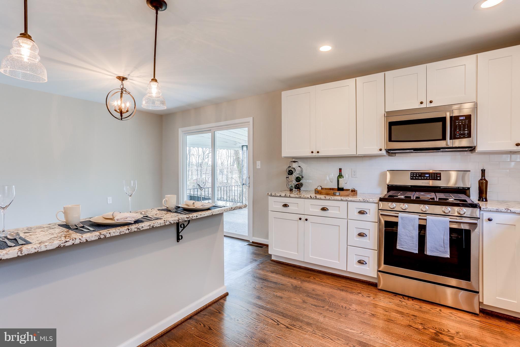 1515 Adamsview Road Baltimore, MD 21228 - Photo 5 of 26 Granite countertops and gas range