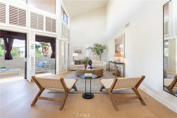 a dining room with furniture and wooden floor