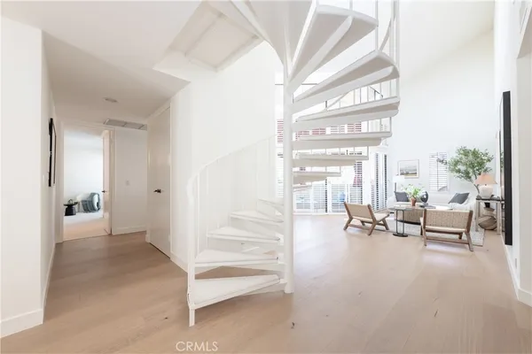 a bedroom with a bed and glass window