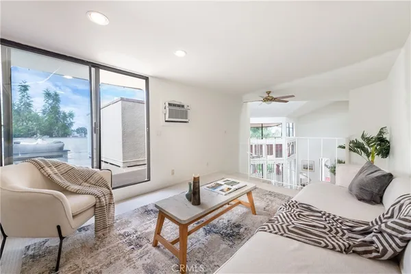 a view of balcony and dining room with furniture