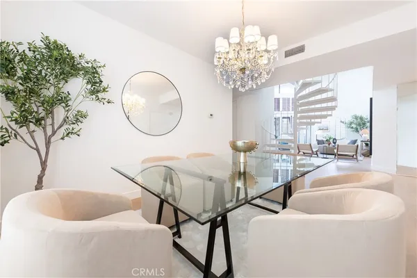 a living room with a chandelier and a chandelier
