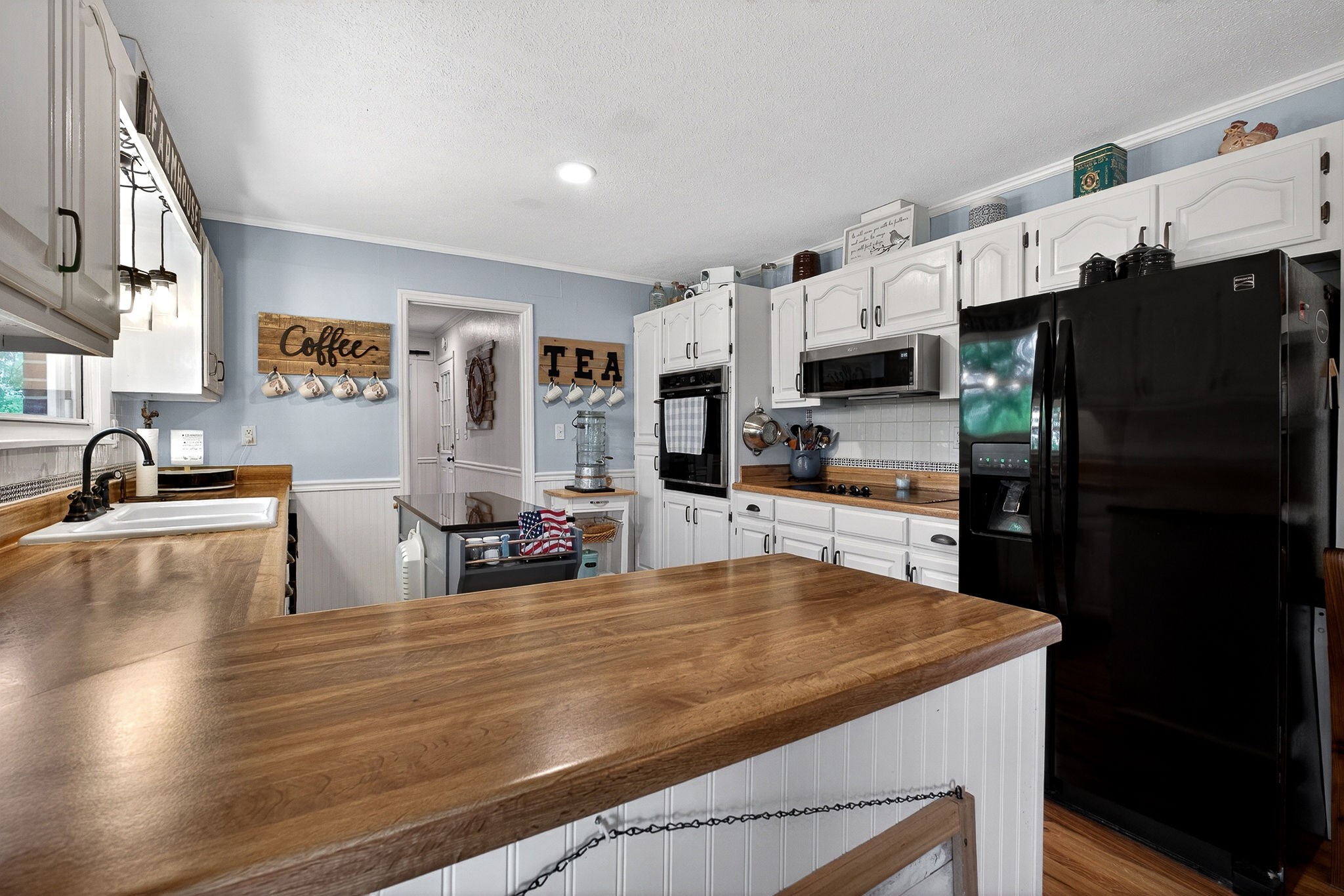 1755 Burgess Falls Road Sparta, TN 38583 - Photo 23 of 56 a kitchen with stainless steel appliances a refrigerator and a stove top oven