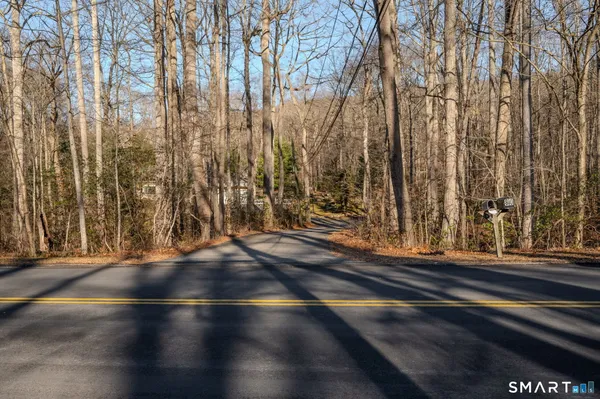a view of room with window and wooden floor