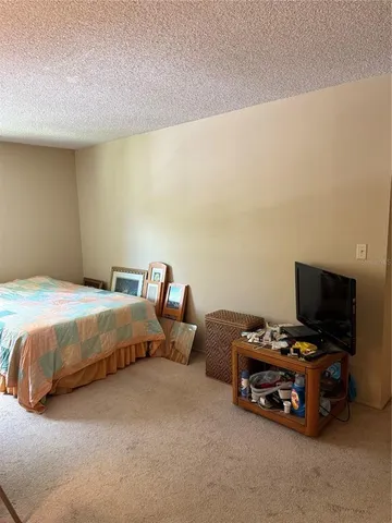 a backyard of a house with lots of green space and lake