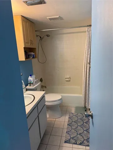 a building outdoor space with patio furniture and potted plants