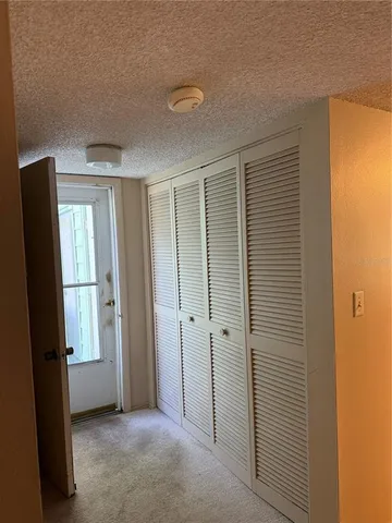 a bedroom with furniture and a flat screen tv