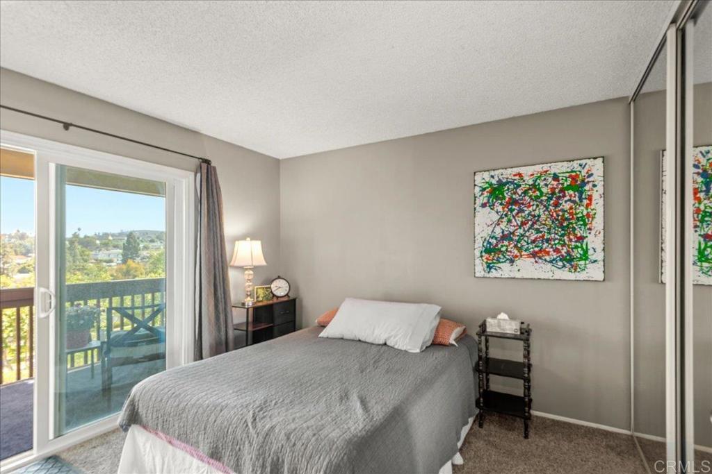 3047 Highlands Boulevard Spring Valley, CA 91977 - Photo 19 of 39 a bedroom with a bed and a painting on the wall