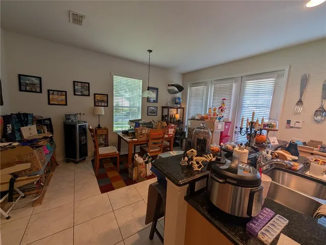 a living room with lots of furniture and a window