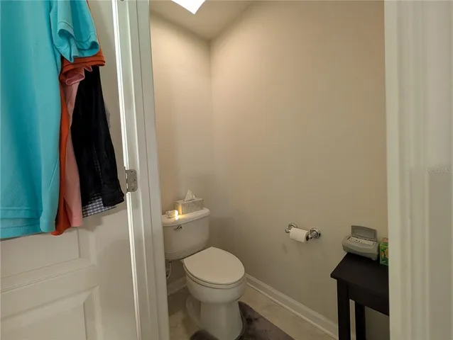 a bathroom with a toilet and a tub