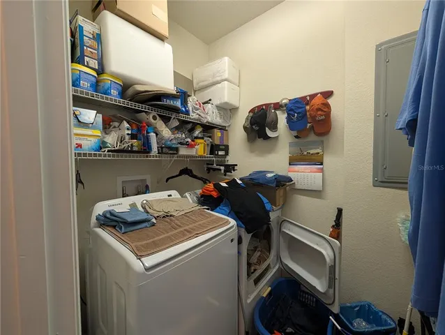 a view of storage and utility room with washer and dryer