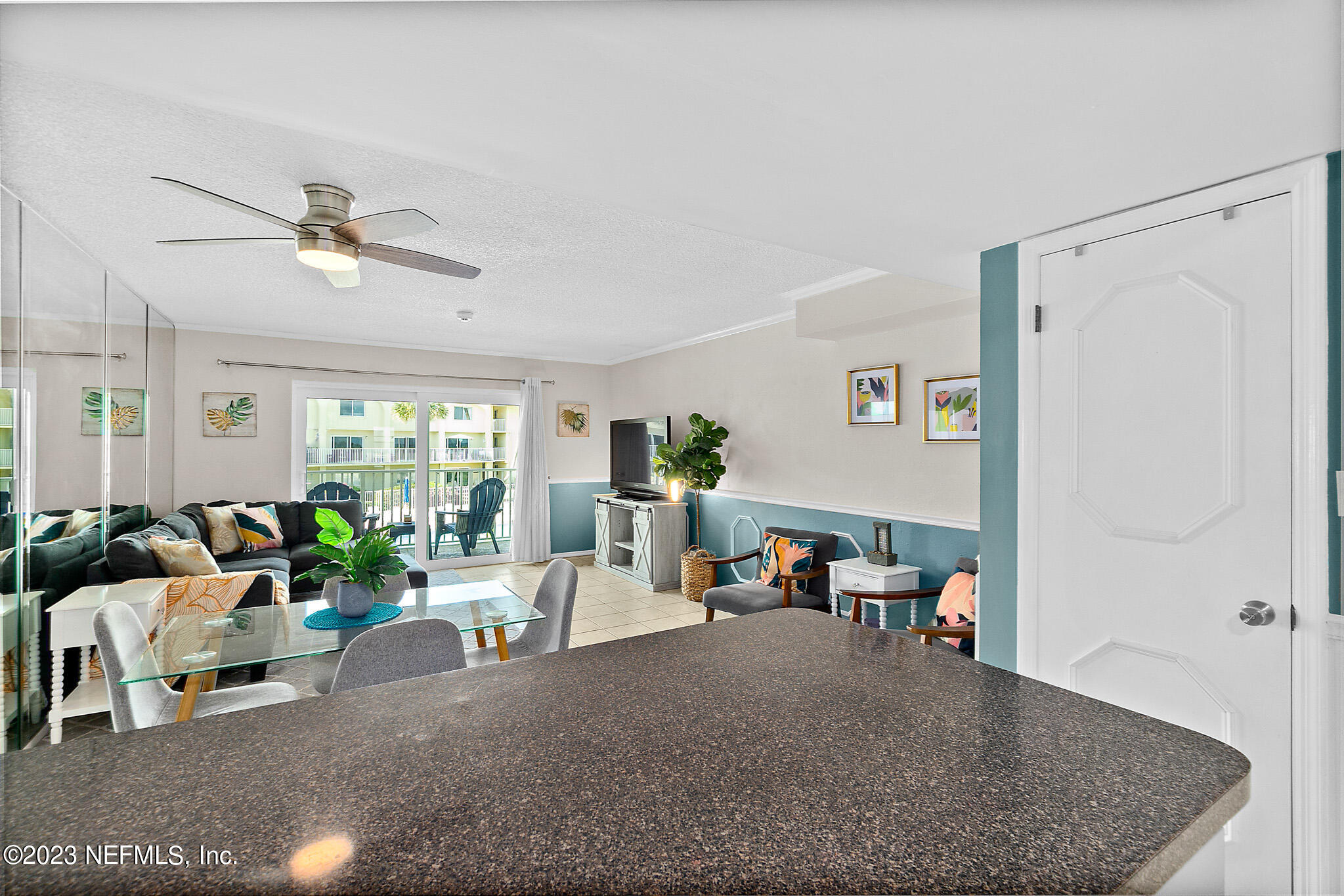 1 Ocean Trace Road, Unit 242 St. Augustine, FL 32080 - Photo 15 of 42 a living room with furniture and a large window