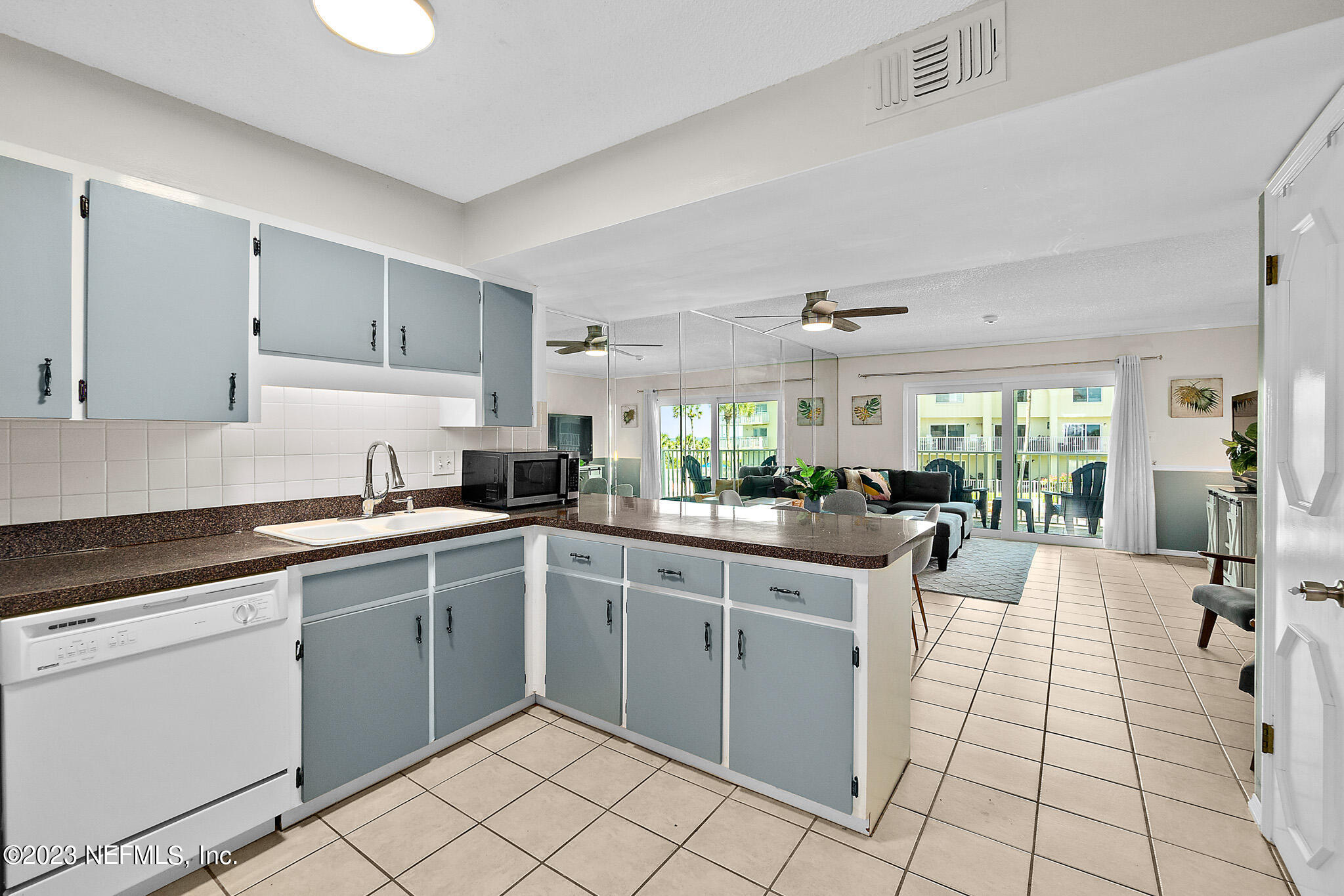 1 Ocean Trace Road, Unit 242 St. Augustine, FL 32080 - Photo 18 of 42 a kitchen with a sink cabinets and window