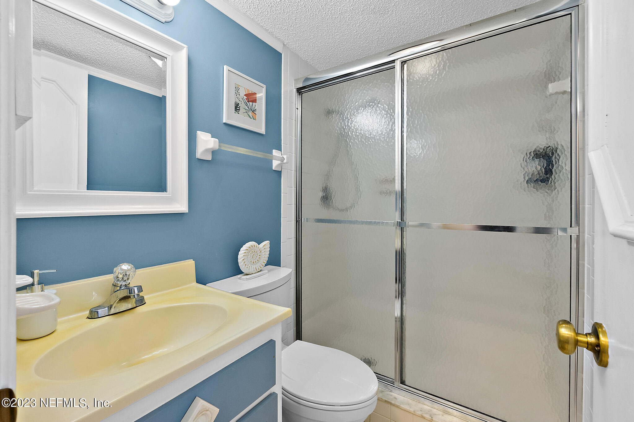 1 Ocean Trace Road, Unit 242 St. Augustine, FL 32080 - Photo 20 of 42 a bathroom with a sink toilet and shower
