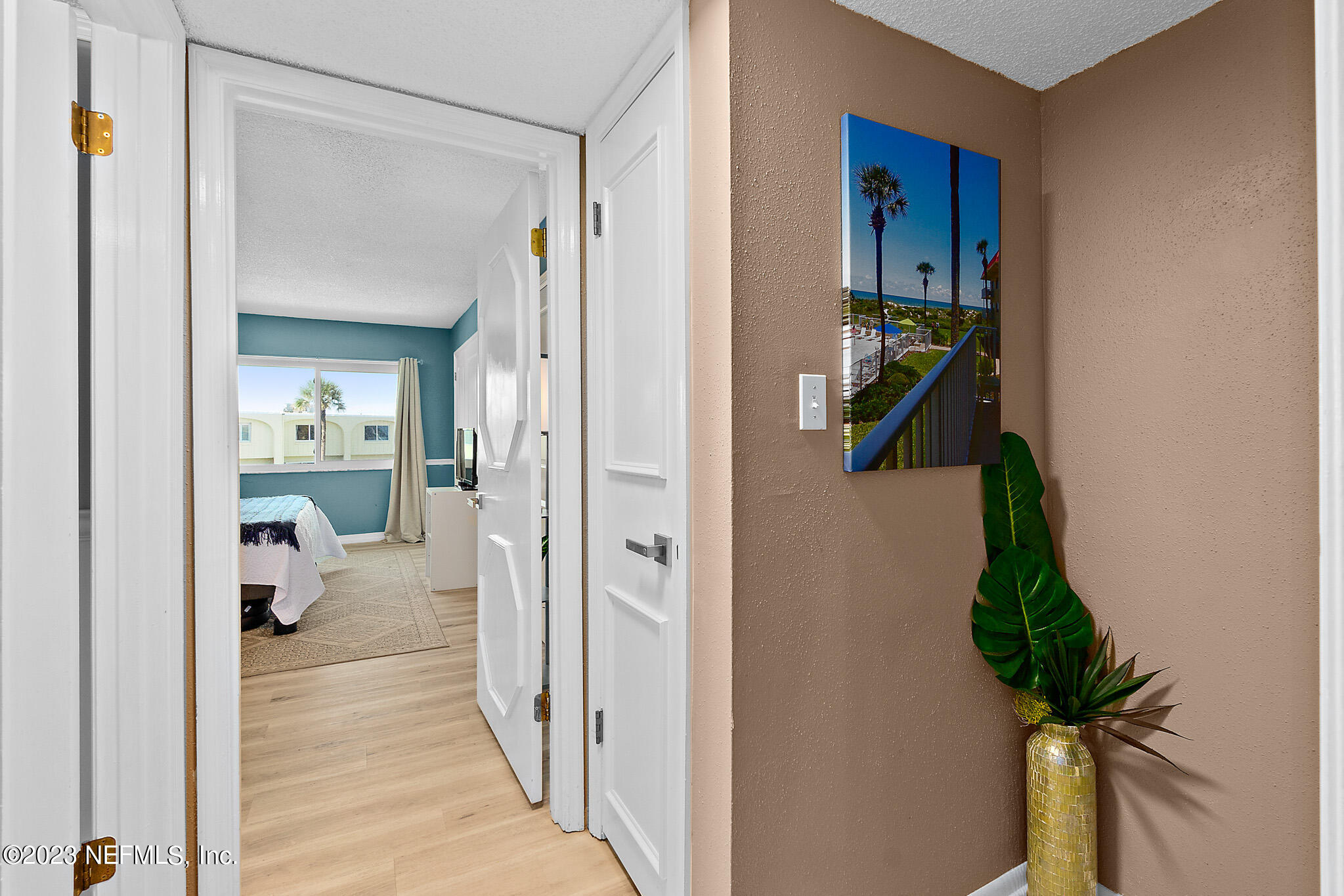 1 Ocean Trace Road, Unit 242 St. Augustine, FL 32080 - Photo 21 of 42 a hallway with painting and a potted plant