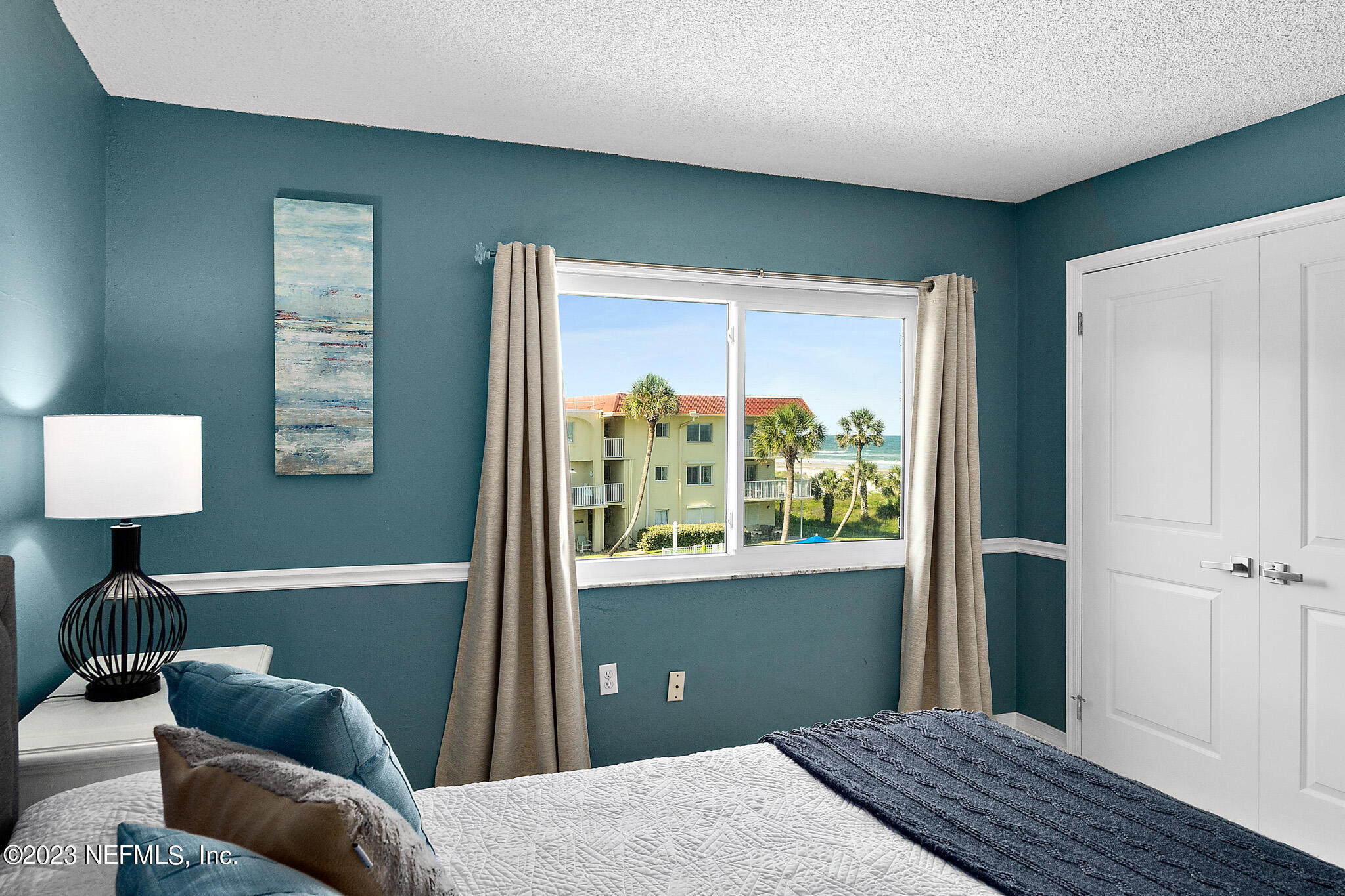 1 Ocean Trace Road, Unit 242 St. Augustine, FL 32080 - Photo 24 of 42 a bedroom with furniture and a window