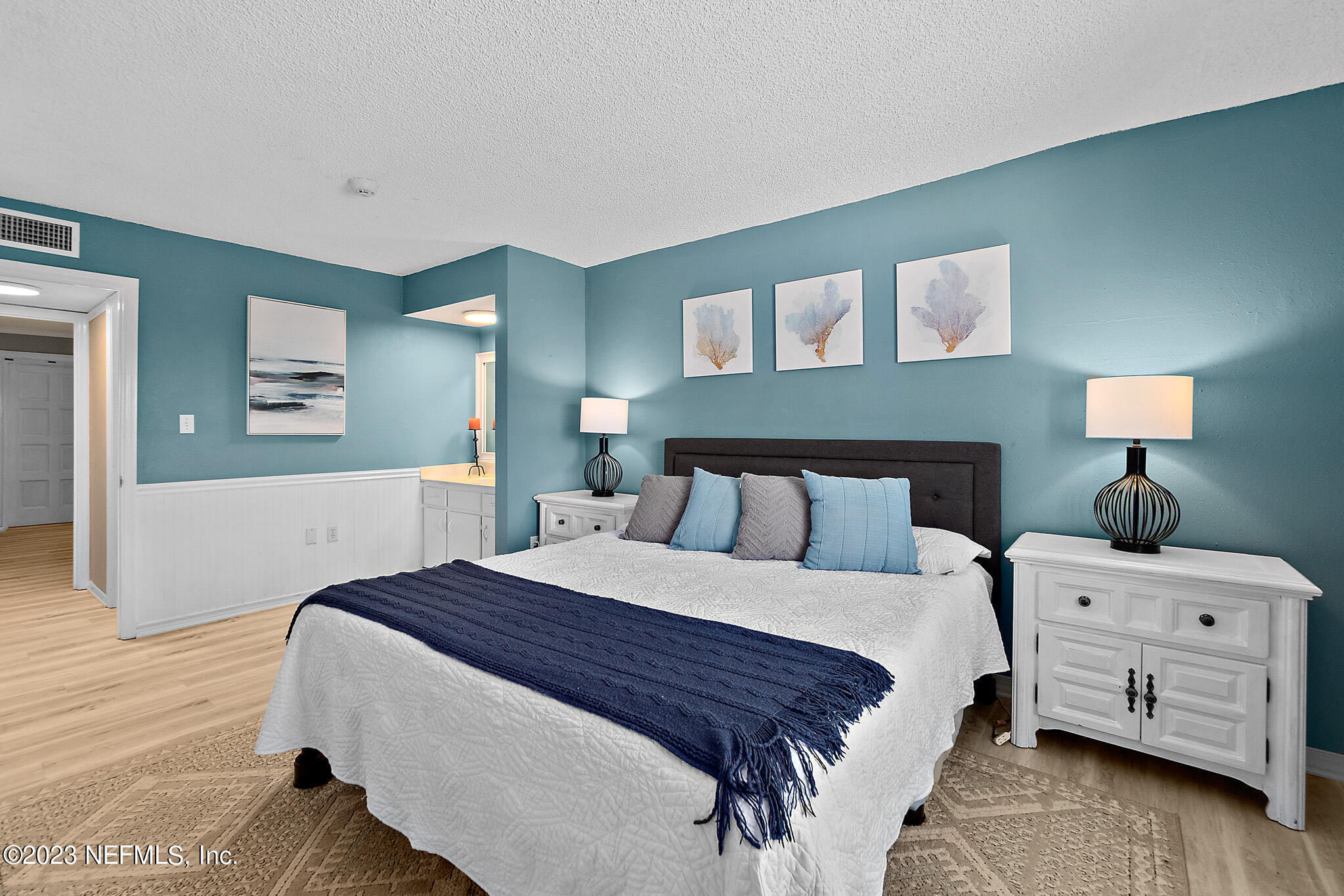 1 Ocean Trace Road, Unit 242 St. Augustine, FL 32080 - Photo 25 of 42 a bedroom with a bed and a night stand