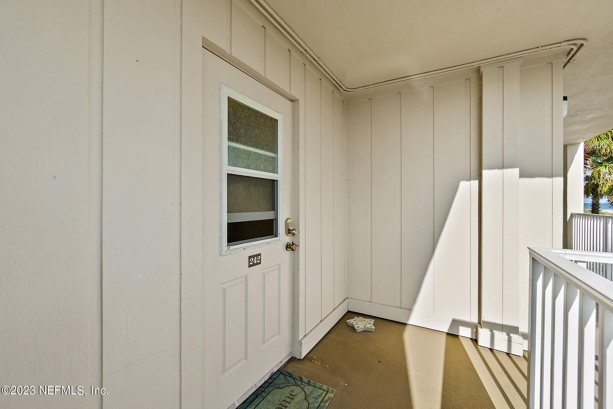 1 Ocean Trace Road, Unit 242 St. Augustine, FL 32080 - Photo 32 of 42 a view of a hallway with wooden floor and entryway