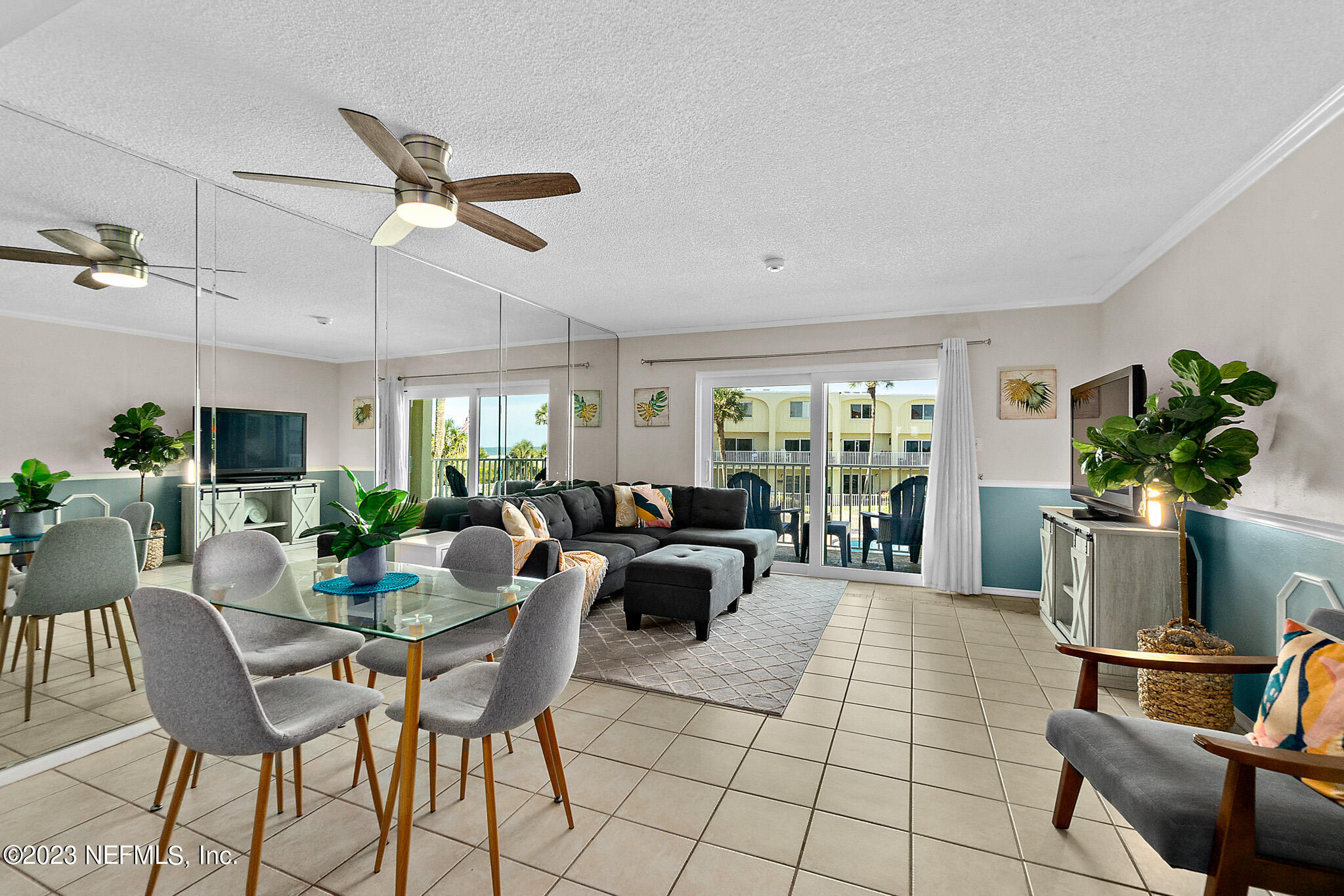 1 Ocean Trace Road, Unit 242 St. Augustine, FL 32080 - Photo 4 of 42 a living room with fireplace furniture and a potted plant