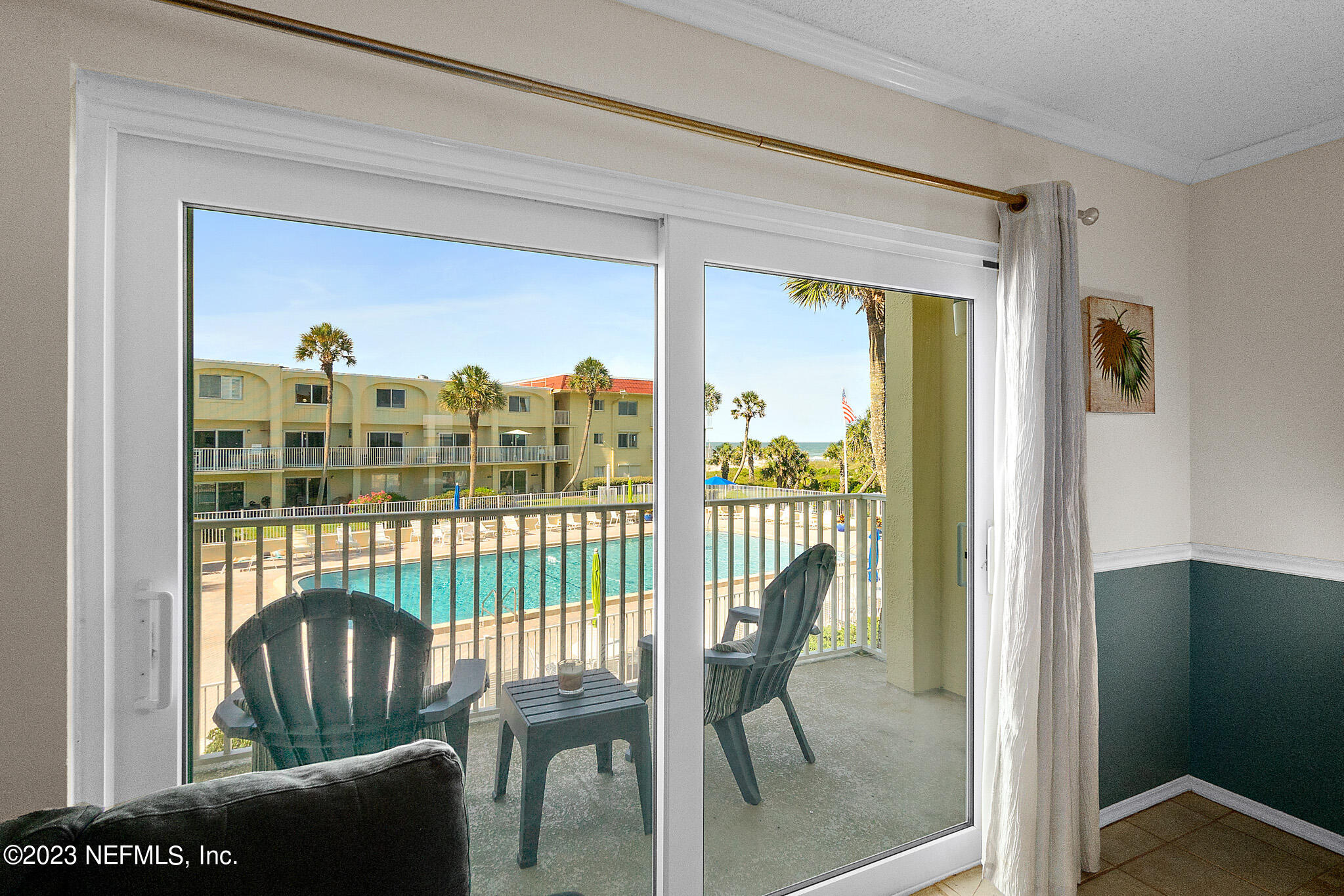 1 Ocean Trace Road, Unit 242 St. Augustine, FL 32080 - Photo 8 of 42 a view of a porch with a table and chairs