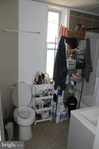 a bathroom with a toilet and a vanity