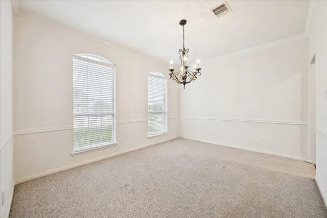 a view of empty room with windows