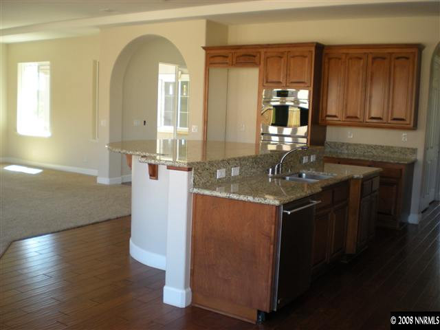 10010 Burghley Lane Reno, NV 89521 - Photo 4 of 9 a kitchen with sink and mirror
