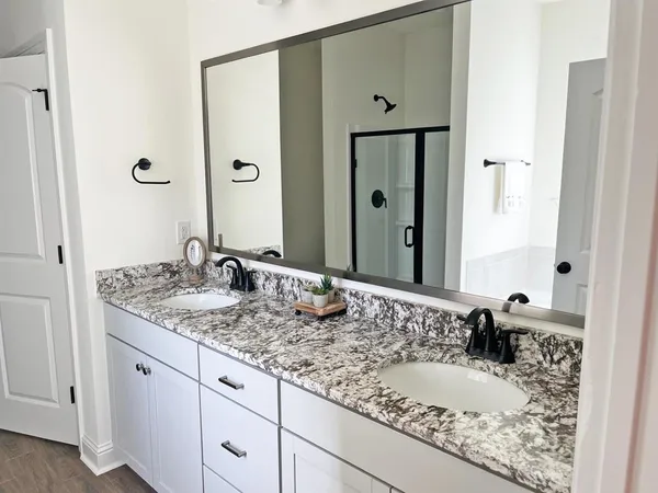 a bathroom with a bathtub and a window