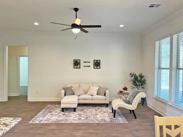 a living room with furniture and a rug