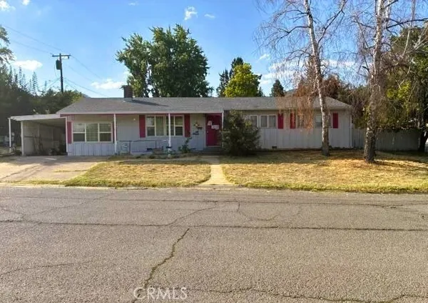 a view of a house with swimming pool in front of it