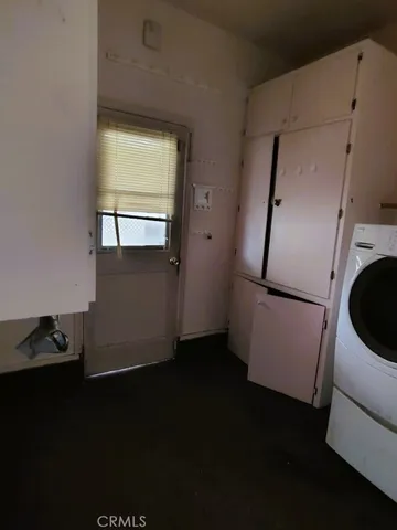 a view of walk in closet with a window