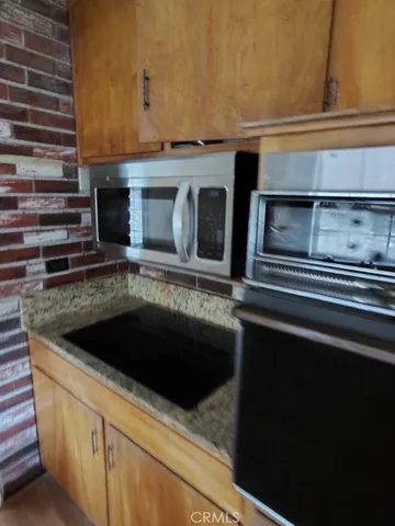 a kitchen with a stove and a microwave